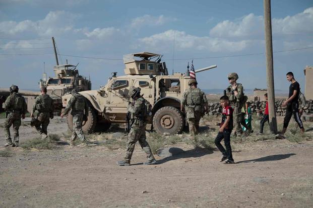 U.S. Army soldiers visit a local village in Syria.