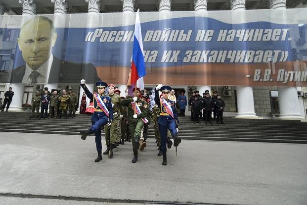 Youth take part in an action to mark the ninth anniversary of Crimea annexation from Ukraine