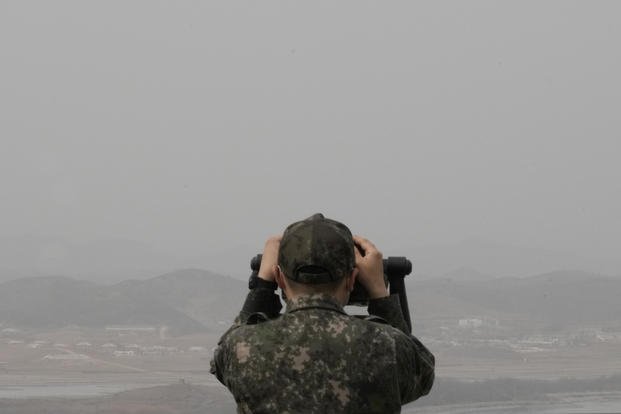 South Korean army soldier watches the North Korea side from the Unification Observation Post