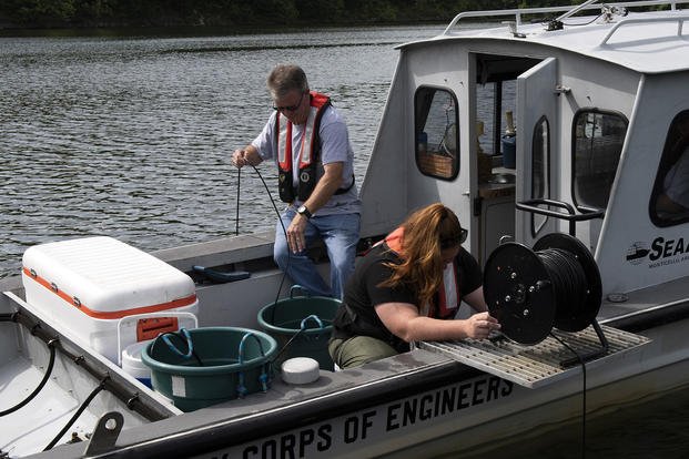 A U.S. Army Corps of Engineers hydrologist and biologist collect water temperatures at Lake Cumberland in Kentucky.