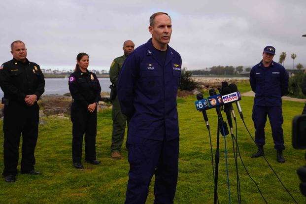 U.S. Coastguard Sector Commander for San Diego speaks to news reporters.