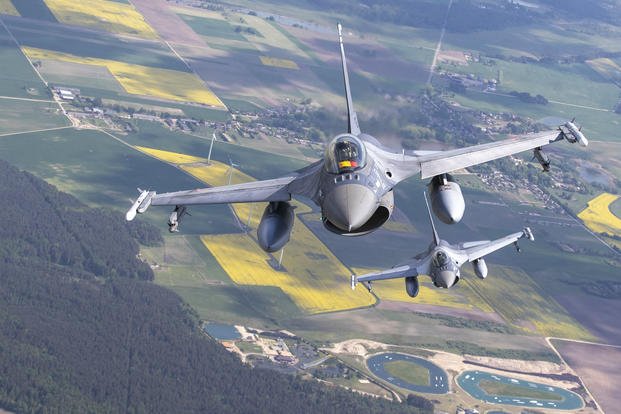 Romanian Air Force F- 16s military fighter jets participating in NATO's Baltic Air Policing Mission