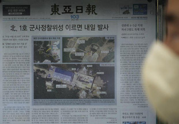 newspaper showing file images of the Sohae Satellite Launching Station in Tongchang-ri, North Korea