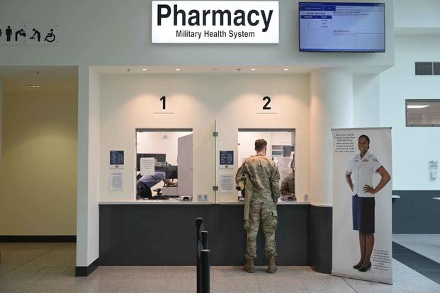 A patient is serviced at the KMCC Satellite Pharmacy at Ramstein Air Base.