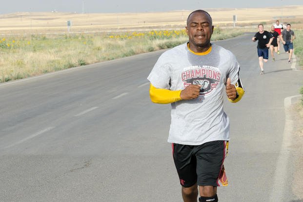 Lt. Col. FaMarcon Mobley finishes the 8-kilometer portion of the Seattle Half Marathon and 8K shadow run near Erbil, Iraq.