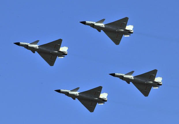 Fighter jets fly in formation 