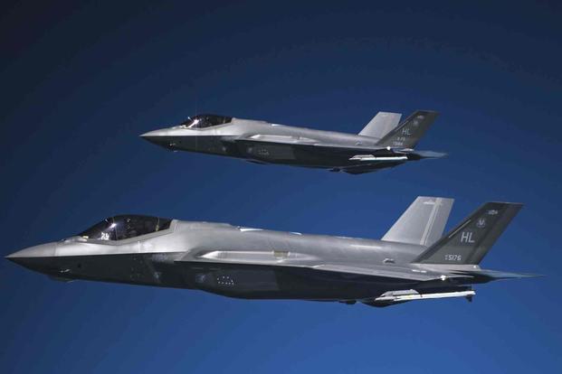 Two F-35A Lightning IIs fly in formation