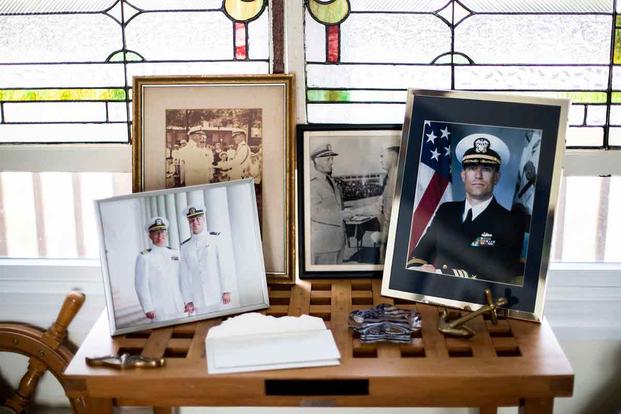 Photos and memorabilia sit on display in the Will family home in Hampton, Va.
