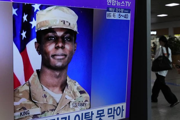 A TV screen shows a file image of American soldier Travis King during a news program at the Seoul Railway Station in Seoul, South Korea.