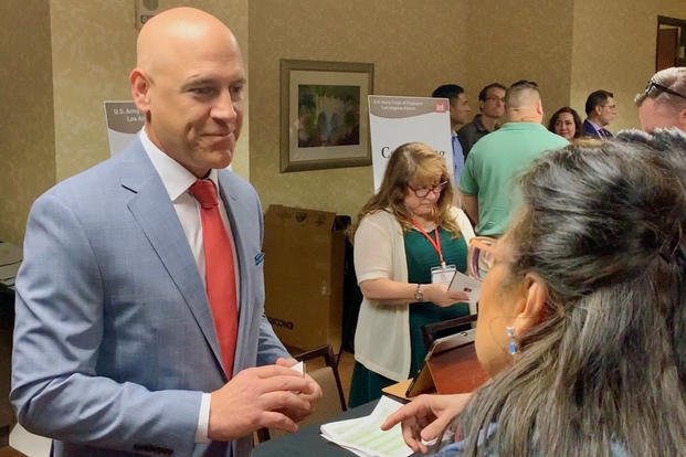 Eric Ravelli, U.S. Army Corps of Engineer Los Angeles District’s deputy of the small business program, speaks with participants of the Spring Business Opportunities Open House.