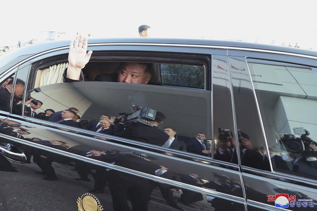 North Korean leader Kim Jong Un responds as Russian President Vladimir Putin sends him off from the Vostochny cosmodrome