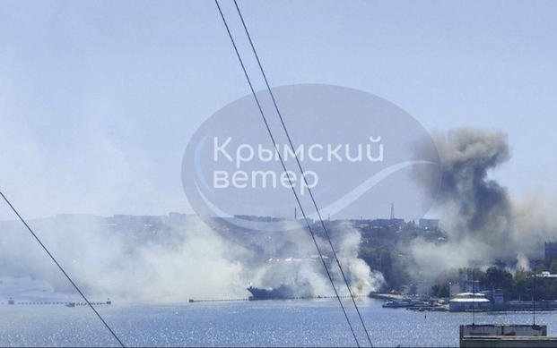  smoke rising from the headquarters of Russia’s Black Sea Fleet in Sevastopol, Crimea