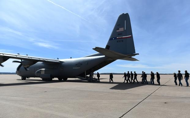 Members of Leadership Abilene walk onto a C-130J Super Hercules for a familiarization flight at Dyess Air Force Base, Texas, March, 16, 2018. 