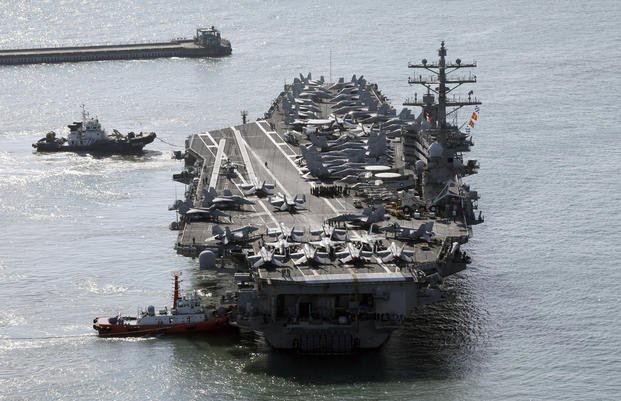 U.S. nuclear-powered aircraft carrier USS Ronald Reagan is escorted as it arrives in Busan, South Korea