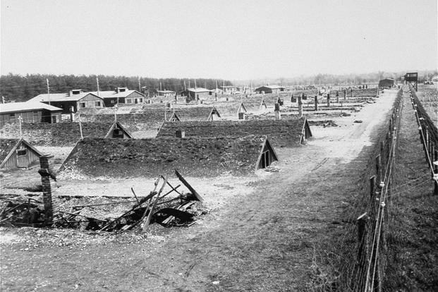 This is a view of the barracks after the liberation of Kaufering, a network of subsidiary camps of the Dachau concentration camp, in Landsberg-Kaufering, Germany.