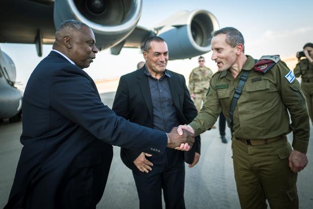 U.S. Secretary of Defense Lloyd J. Austin III greets Israeli military leaders. 