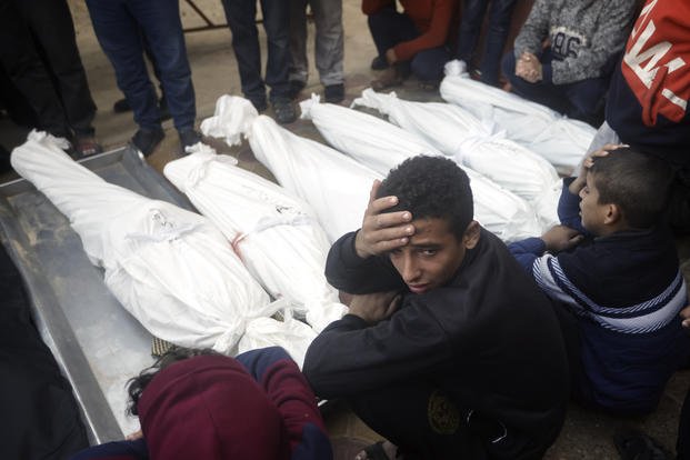 Palestinians mourn relatives killed in the Israeli bombardment of the Gaza Strip