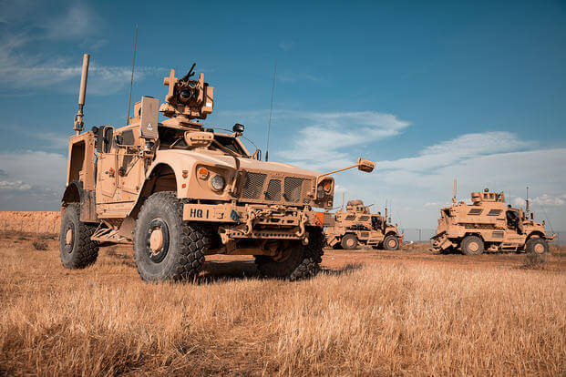 U.S. soldiers of the 1st Battalion, 5th Infantry Regiment, 1st Brigade Combat Team, 25th Infantry Division, use Joint Light Tactical Vehicles to provide 360-degree security at Al Asad Air Base, Iraq.