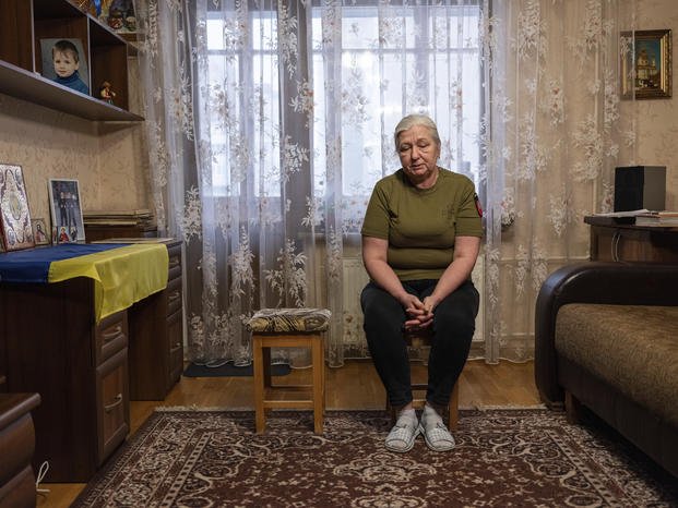 Iryna Reva, 59, waits for her son Vladyslav at her apartment in Kyiv, Ukraine