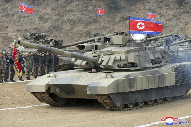North Korea’s Kim Test Drives a New Tank and Orders Troops to Prepare for War