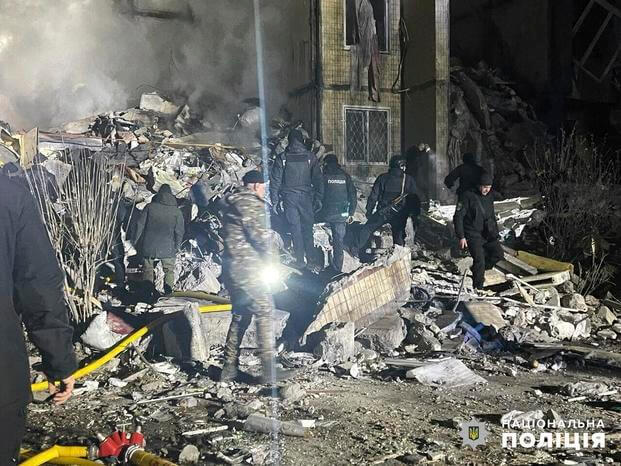Emergency workers work on the site of a destroyed building in Odesa, Ukraine.