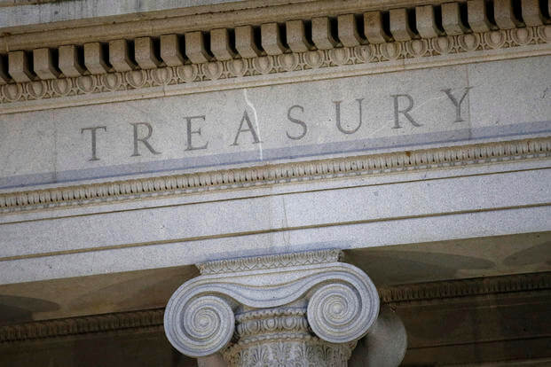 U.S. Treasury Department building at dusk in Washington