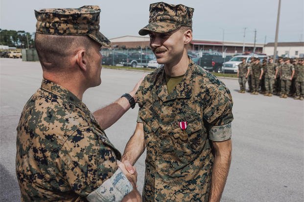 Marine Corps Cpl. Gage Barbieri received the Meritorious Service Medal for his contribution to the JLTV program. 