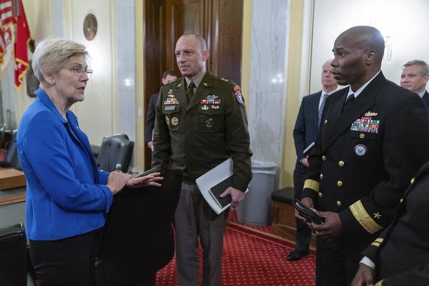 Sen. Elizabeth Warren, Major General Johnny K. Davis and Rear Admiral Alexis T. Walker