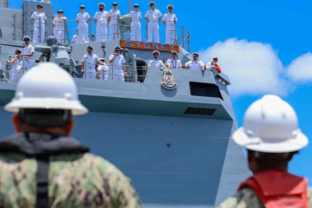 U.S. Navy sailors assist in mooring Royal Australian Navy's HMAS Sydney