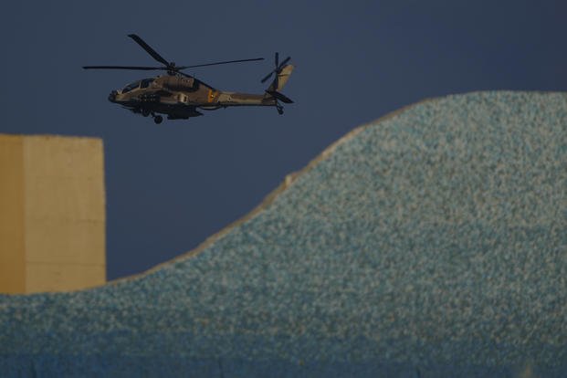 An Israeli Apache helicopter flies over Israel.