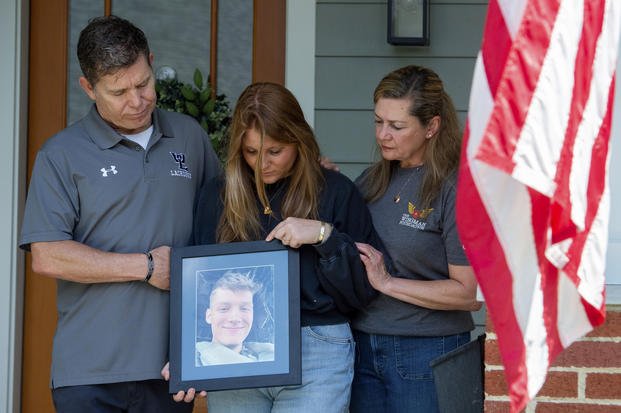 Family members of Marine Corporal Spencer R. Collart