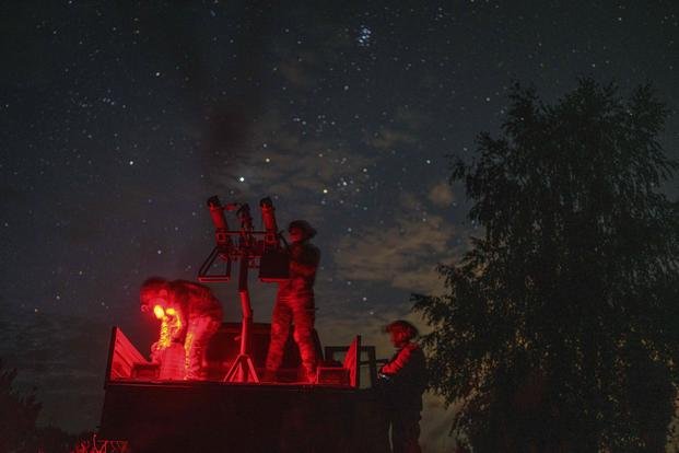 A volunteer for an air-defense unit prepares a machine gun near Bucha, Kyiv region, Ukraine.