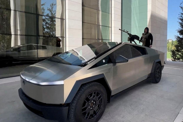 No, this isn't a frame from "Mad Max: Fury Road"; that's Chechen leader Ramzan Kadyrov with a machine gun in the back of a Tesla Cybertruck. 