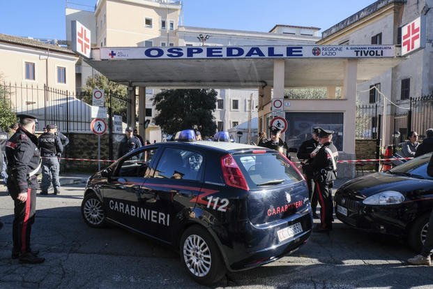 Italian paramilitary police officers stand outside a hospital in Italy. 