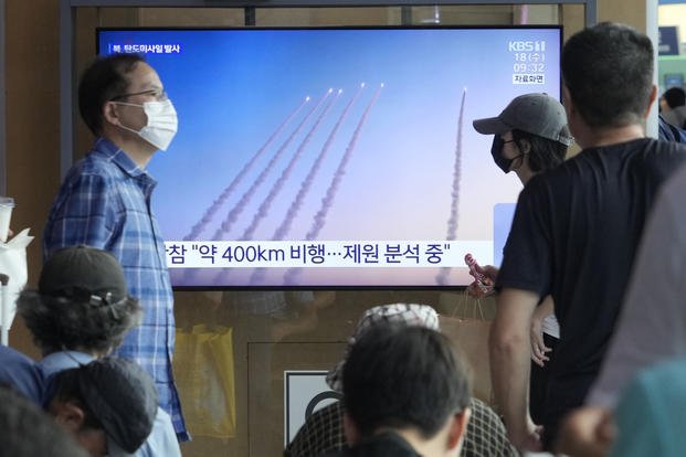 North Korea's missiles launch during a news program at Seoul Railway Station in Seoul, South Korea