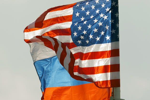 U.S. and Russian national flags wave at Moscow's Vnukovo airport