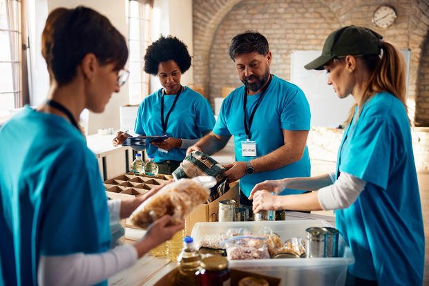 Volunteers sorting food at a food bank