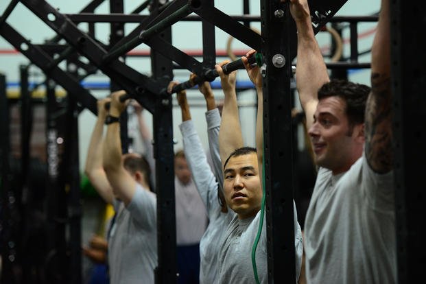 Airmen from the 607th Air Support Operations Group work out together at the fitness center on Osan Air Base, Republic of Korea.