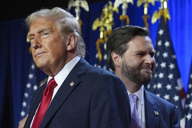 Republican presidential nominee and former President Donald Trump is shown with Republican vice presidential nominee Sen. JD Vance, R-Ohio, at an election night watch party at the Palm Beach Convention Center in West Palm Beach, Fla. 