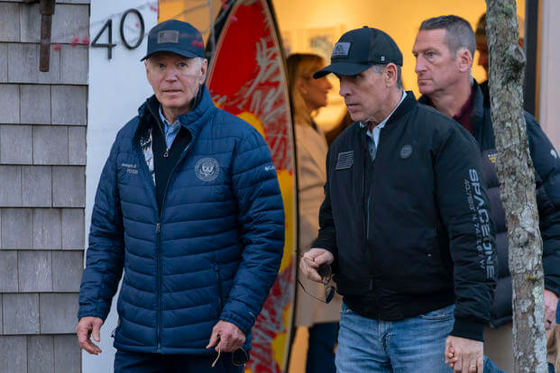 President Joe Biden and son Hunter Biden walk in downtown Nantucket Mass.