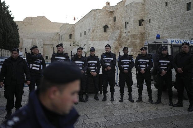 Palestinian police line up next to Church of the Nativity.