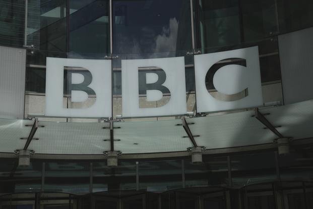 A logo of the BBC marks the BBC Headquarters in London