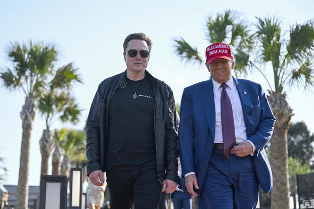 President-elect Donald Trump walks with Elon Musk