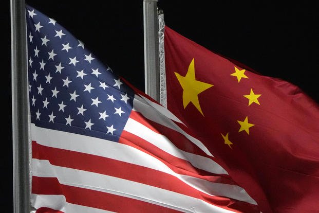 The American and Chinese flags wave at Genting Snow Park ahead of the 2022 Winter Olympics