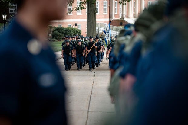 Coast Guard Cadets march in formation during sea trials at the Academy