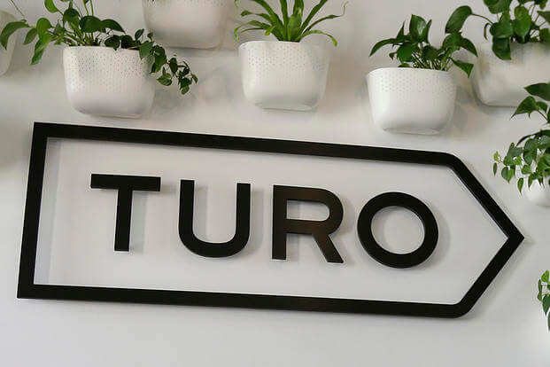 The Turo logo is shown in the entryway of Turo in San Francisco