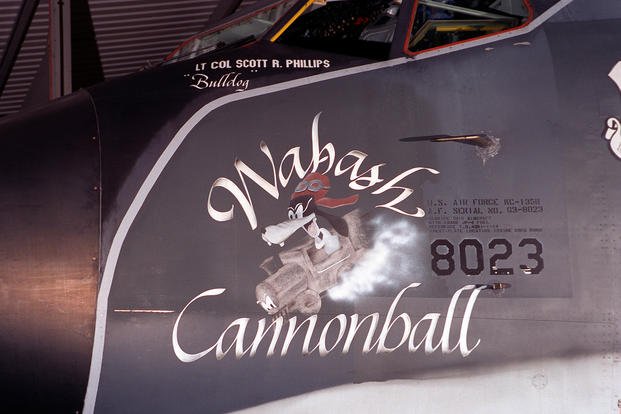 A KC135R Stratotanker from the 100th Aerial Refueling Wing based at RAF Mildenhall, United Kingdom, depicts nose art with  a cartoon dog in a train called the ‘Wabash Cannonball.’ 