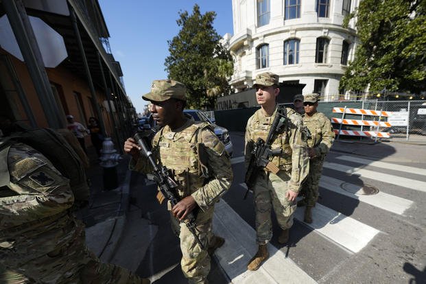Members of the Louisiana National Guard patrol the French Quarter in advance of the upcoming Super Bowl