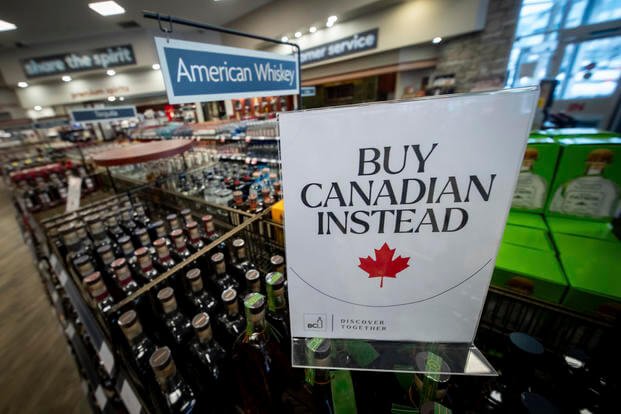 A sign is placed in front of the American whiskey section at a B.C. liquor store 