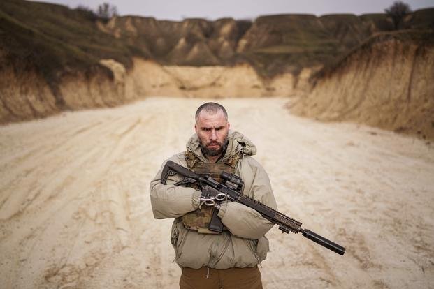 Ukraine soldier holds a rifle during military training near Kyiv, Ukraine.
